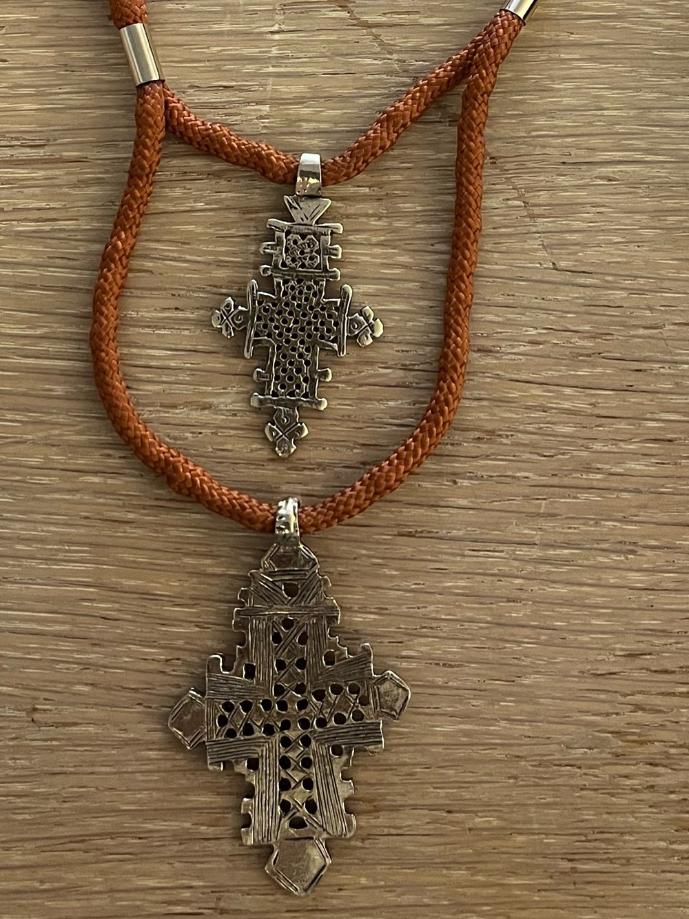 Gold-tone and orange cord Ethiopian Coptic Cross Pendant